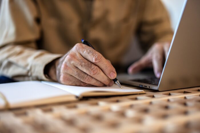 Image of hand and computer