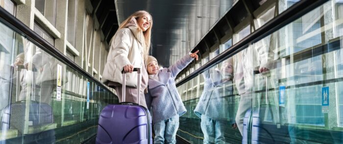 Mother,And,Daughter,At,The,Station,Go,Down,The,Escalator